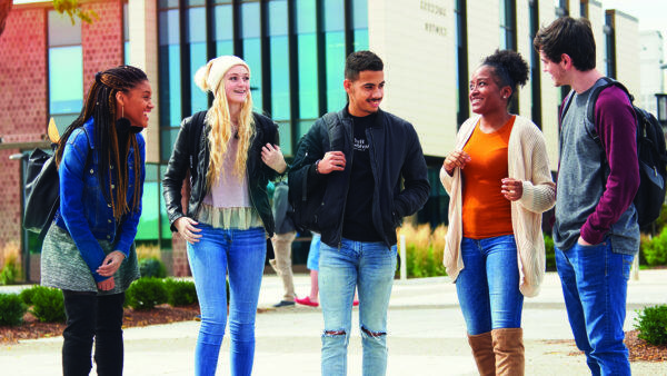 Four students talking near the Student Success Center